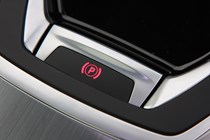 Peugeot 308 Hatchback (2014-) UK rhd model in metallic silver. Interior detail - electronic parking brake