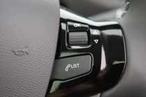 Peugeot 308 Hatchback (2014-) UK rhd model in metallic silver. Interior detail - menu selector thumb wheel on steering wheel