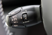 Peugeot 308 Hatchback (2014-) UK rhd model in metallic silver. Interior detail - cruise control enable/disable/set