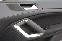 Peugeot 308 Hatchback (2014-) UK rhd model in metallic silver. Interior detail - left-hand door