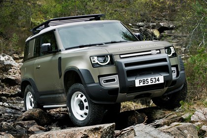 Green 2020 Land Rover Defender 90 front three-quarter off-road