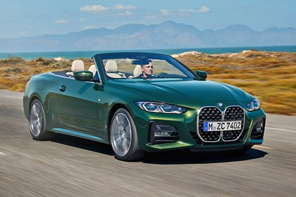Green 2021 BMW 4 Series Convertible front three-quarter driving