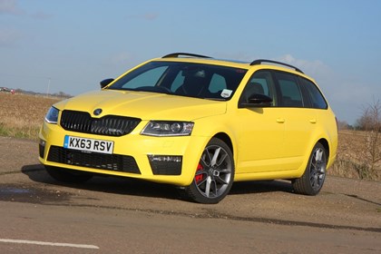 Image of a yellow Skoda Octavia vRS Estate stood static, viewed from the car's front left corner