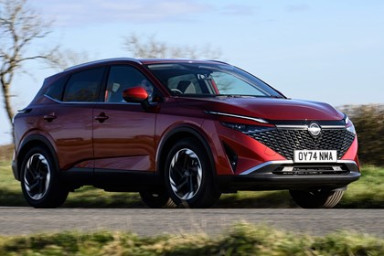 Bestselling cars in the UK 2025: Nissan Qashqai, front three quarter driving, red paint
