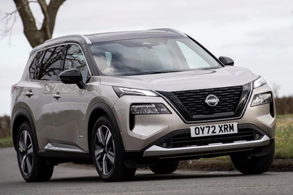 Nissan X-Trail, beige, exterior front three-quarters, driving | Parkers