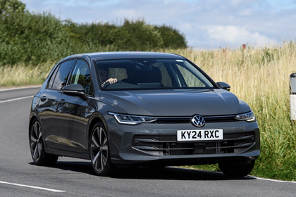 Volkswagen Golf, grey, exterior front three-quarters, driving | Parkers