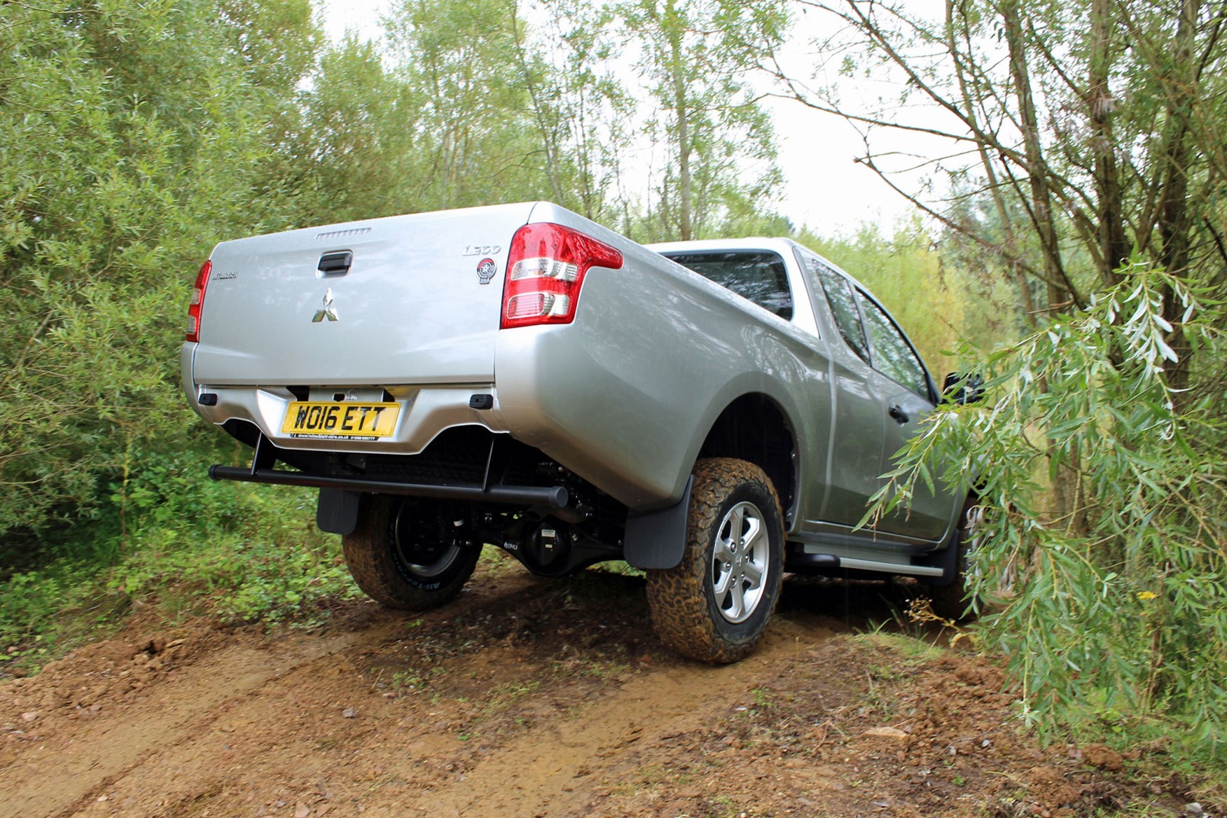 Mitsubishi L200 4Life Club Cab review - rear view, driving off-road, silver