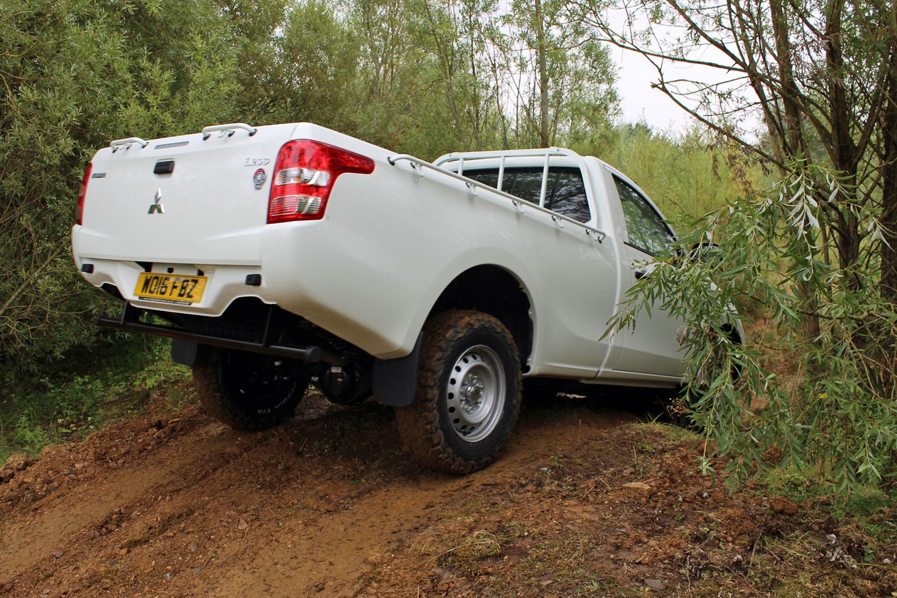 Mitsubishi L200 4Life Single Cab review - rear view, driving off-road, white