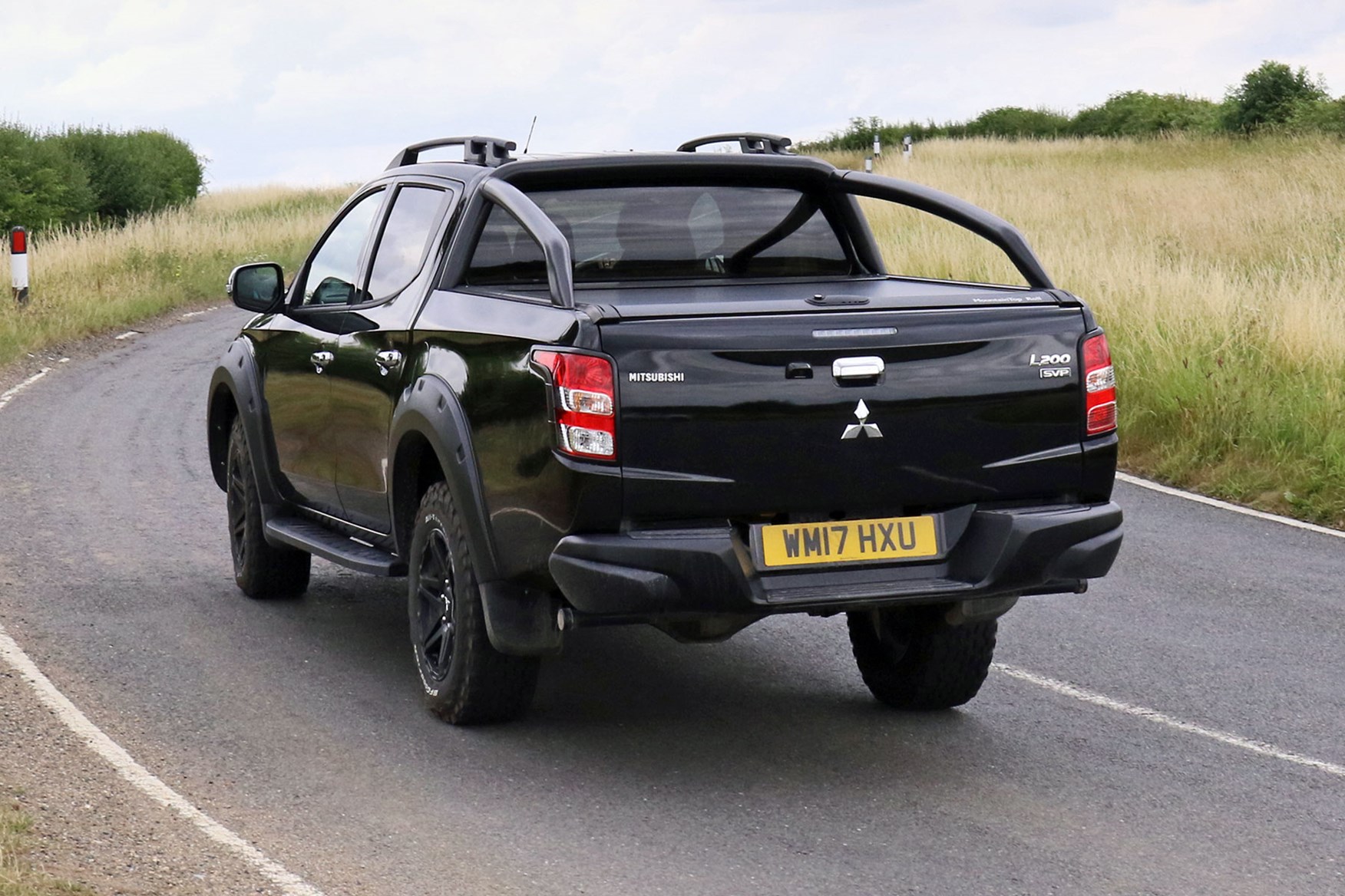 Mitsubishi L200 Barbarian SVP review - rear view, driving on country road