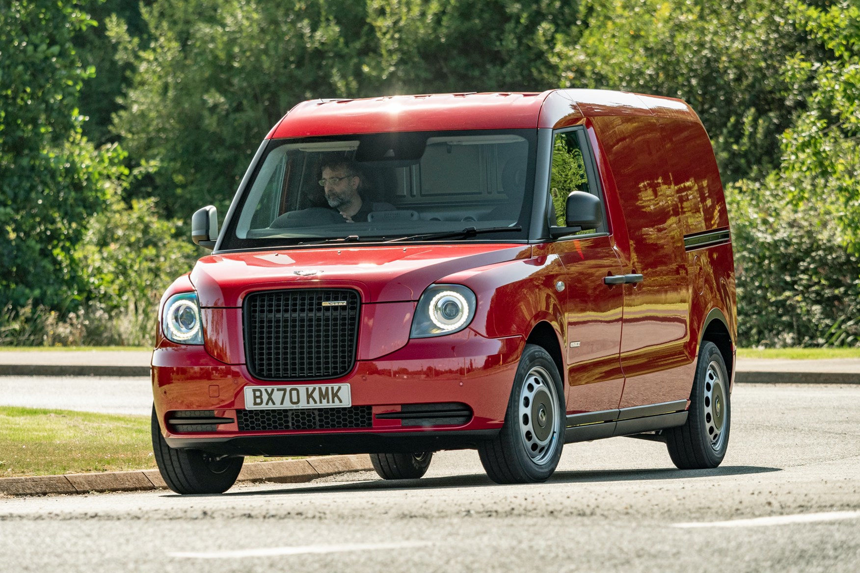 LEVC VN5 electric van review - 2020, front view, red, driving round corner