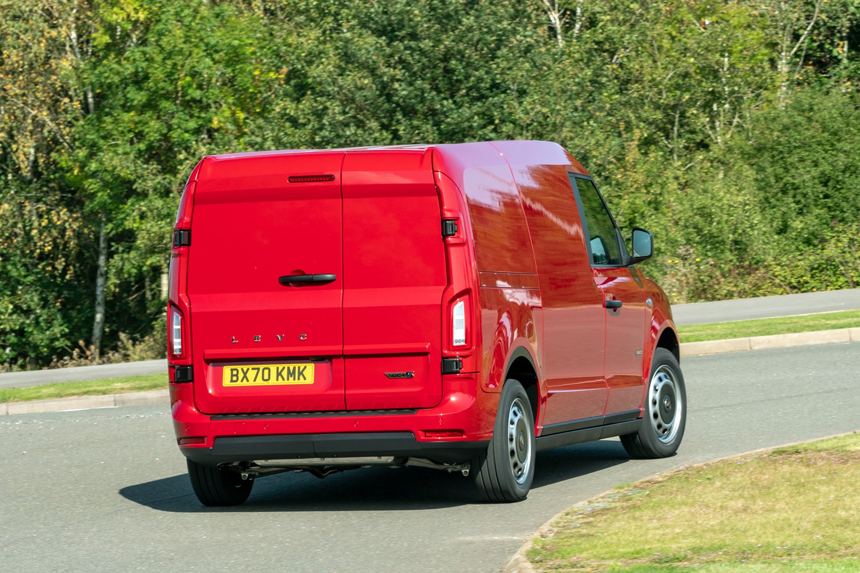 LEVC VN5 electric van review - 2020, rear view, red, driving round corner