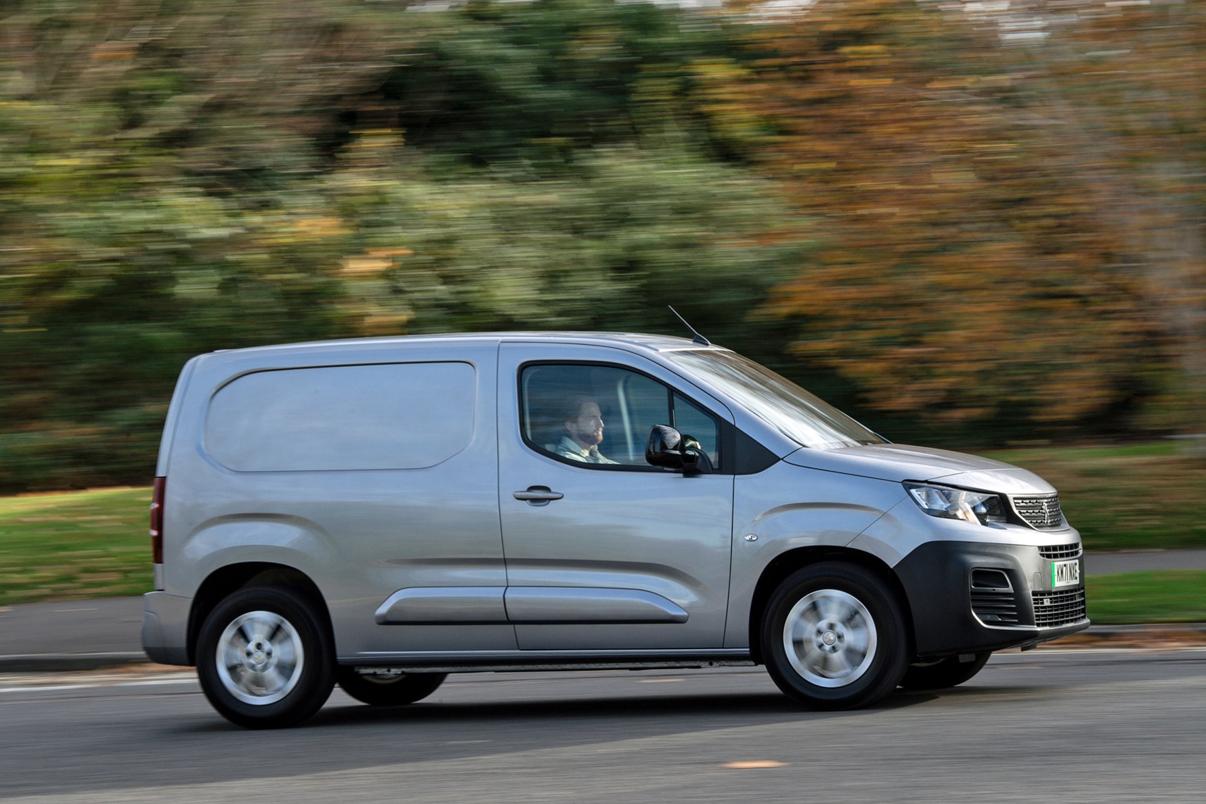 Peugeot e-Expert electric van review - driver side view, silver, driving