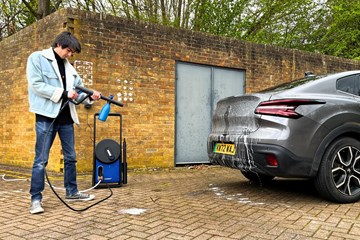 Aaron Hussain cleans a car with the Nilfisk 170
