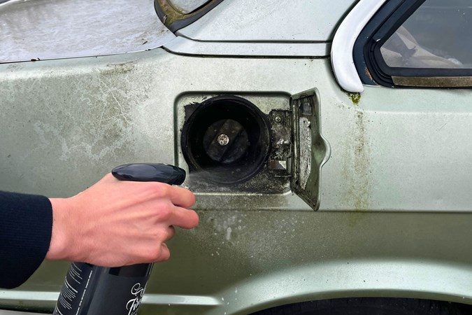 Aaron Hussain applies Auto Finesse to a fuel filler cap