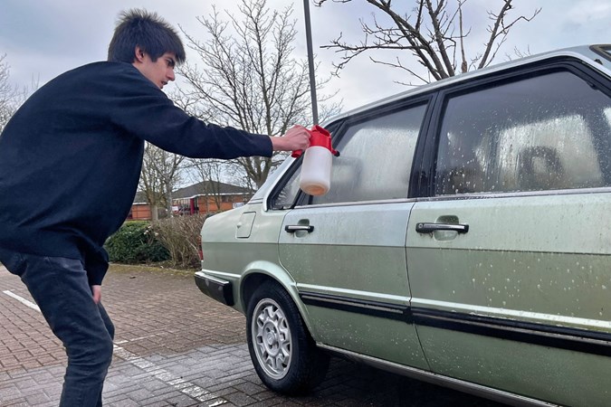 Aaron Hussain cleans a car with the Duel Autocare