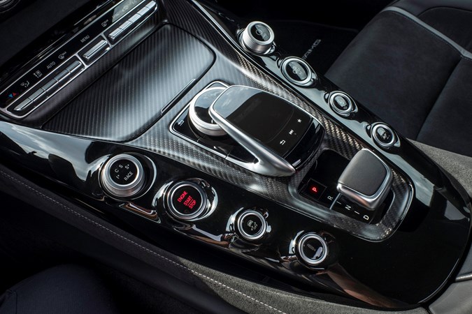 Wide transmission tunnel cuts down on space inside the Mercedes-AMG GT Coupe