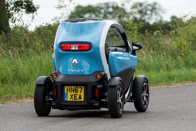 Blue and white 2018 Renault Twizy coupe rear three-quarter driving