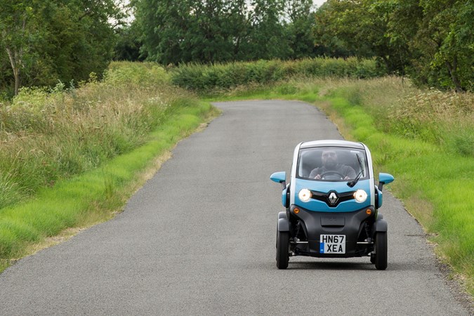 Blue and white 2018 Renault Twizy coupe front elevation driving