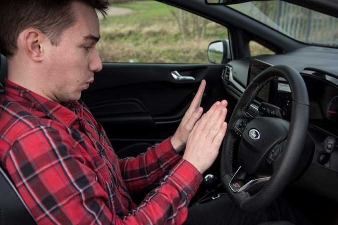 James warms his hands on the Fiesta ST's heated steering wheel 