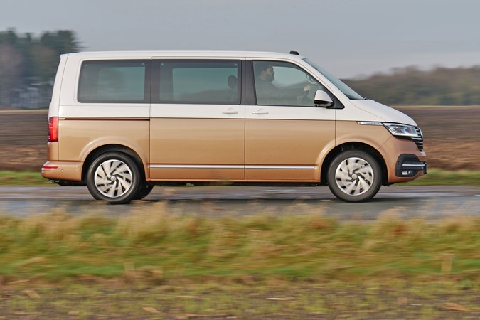2020 Copper and white Volkswagen Caravelle side elevation driving