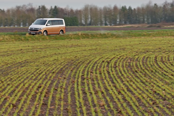 2020 Copper and white Volkswagen Caravelle front three-quarter driving