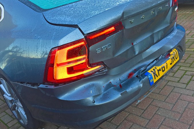 Grey 2017 Volvo S90 rear-end crash damage