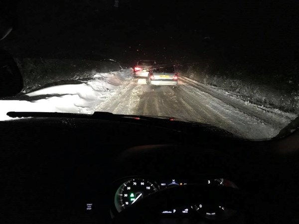 Driving in snow at night - stopped to allow a fellow motorist space!
