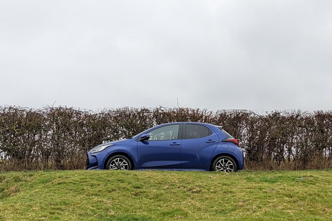Side profile of the Toyota Yaris on a country lane