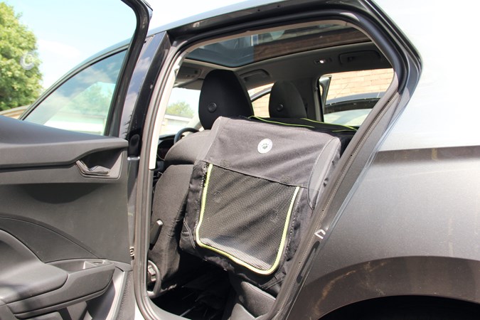 Grey dog crate on the rear seat of the Skoda Fabia long termer with the rear door open