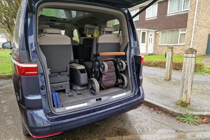 VW Multivan long-term test - folded travel system in boot with all seats present