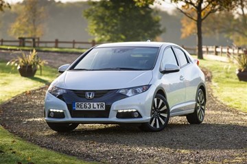 The latest 2014 Honda Civic is distinguished up front by gloss black trim