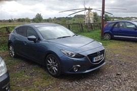 The Parkers Mazda 3 in the paintballing centre car park. Paint not pictured