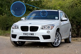 The BMW X1's automatic high-beam assistant takes its information from a sensor behind the windscreen