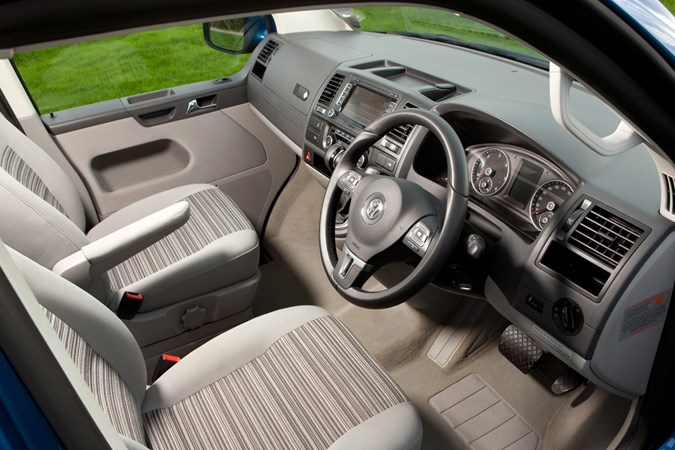 Image of Volkswagen California T5 front interior showing seats and dashboard, from driver's side