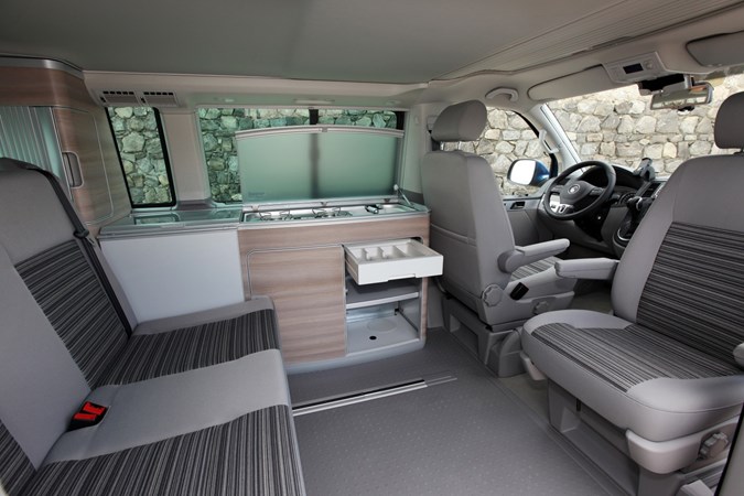 Image of Volkswagen California T5 living area with kitchen drawers open