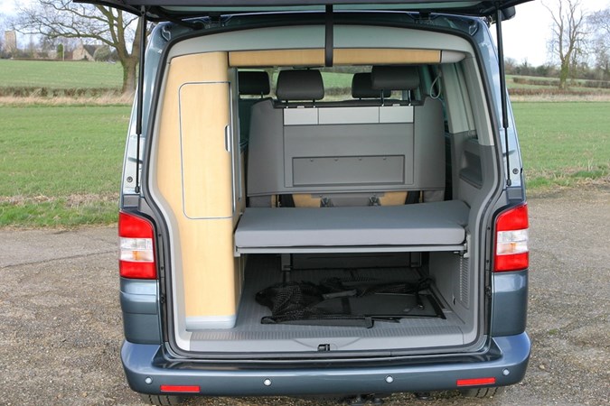 Image of Volkswagen California T5, boot open showing cupboards and bed platform