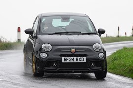 Abarth 695 (2024) review: front three quarter driving, black paint