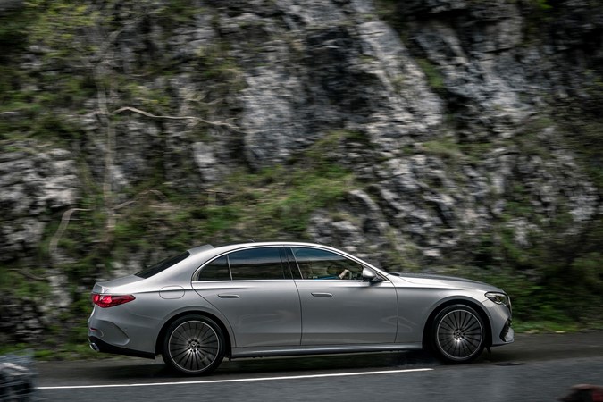 Image of silver Mercedes E-Class saloon, in motion, right side profile view