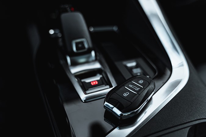 Key fob lying next to a centre console