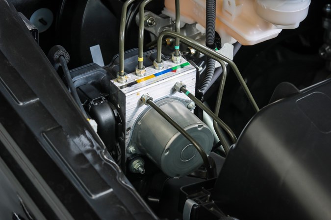 Image of an ABS controller in situ in a car's engine bay