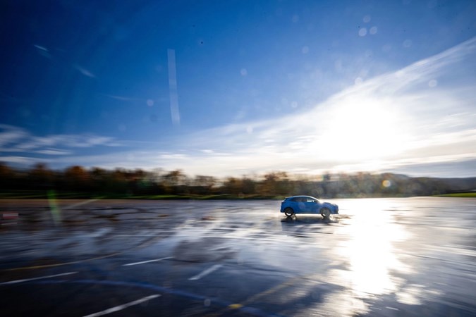 Image of a Ford Puma doing an emergency stop on a very wet surface