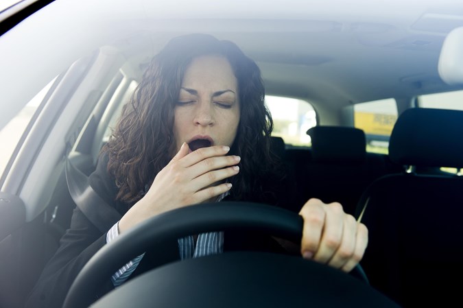 Tired female driver - What is lane-departure warning