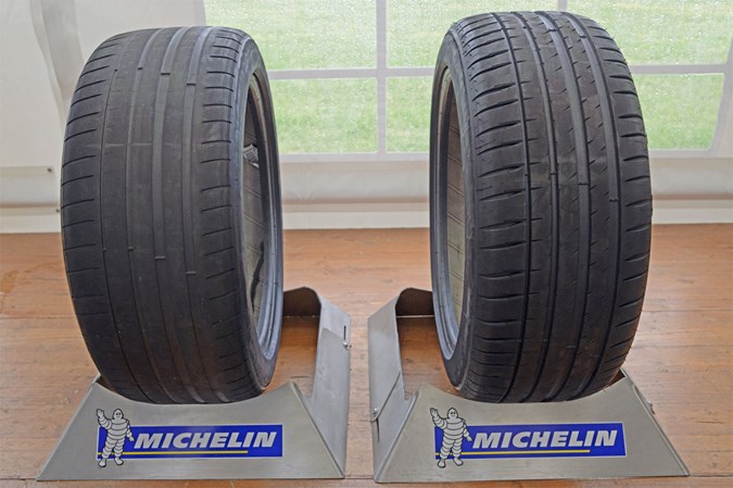 Tyre with 1.6mm tread depth next to a new one