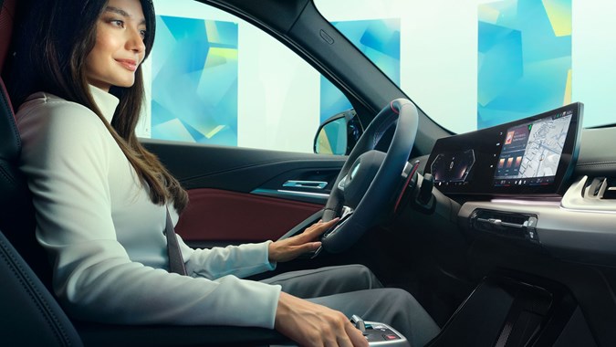 Woman using BMW iDrive