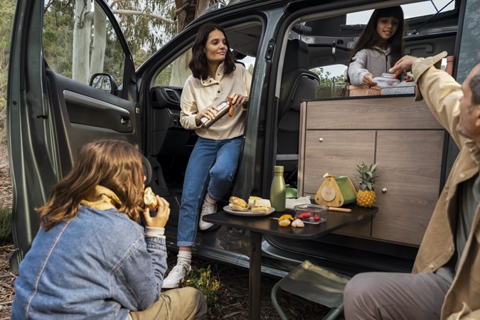 Family picnicking in a Citroen Holidays