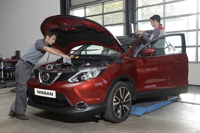 Mechanics servicing a Nissan Qashqai - What is a car service