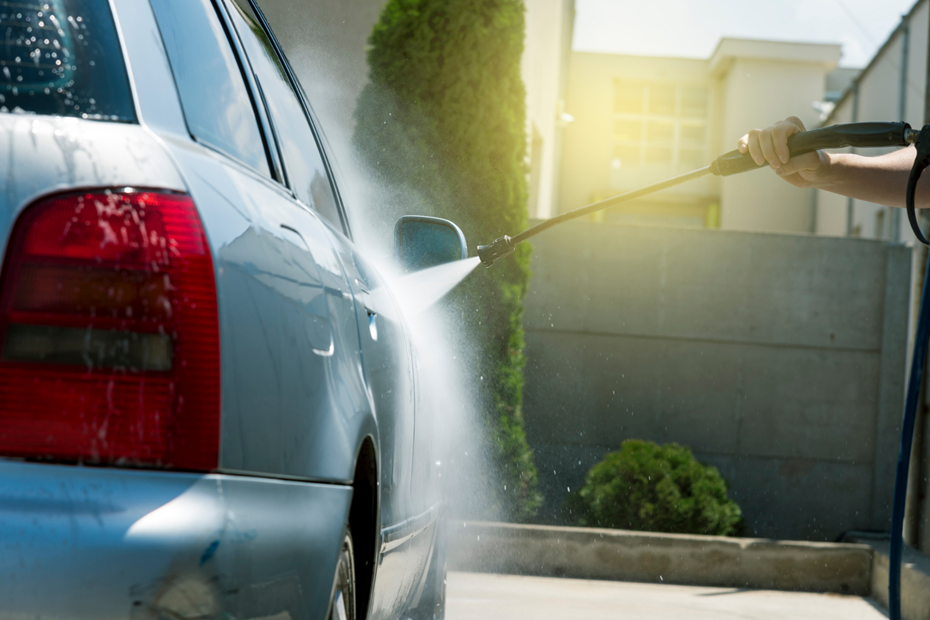 A car being washed with a pressure washer