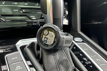 The Garmin Dezl Smartwatch on a gear lever