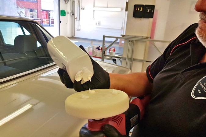 Karl Heath applying renovator to polishing pad
