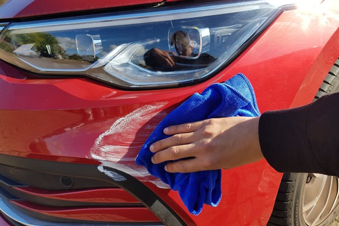 Aaron Hussain applying the Turtle Wax scratch repair and revive to a VW Golf